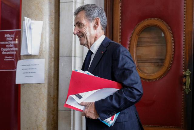 (FILES) France's former president Nicolas Sarkozy leaves the judicial court after being questioned in the appeal trial of the so-called Bygmalion case, which saw him sentenced to one year in prison, in Paris on November 24, 2023. The Court of Cassation delivers its ruling on Nicolas Sarkozy's appeal against his conviction in the Bygmalion case, in Paris, on November 26, 2025. (Photo by Geoffroy Van der Hasselt / AFP)