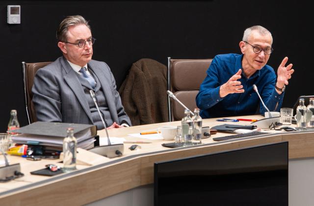 Belgium's Prime Minister Bart De Wever (L) and Belgium's Vice Prime Minister and Minister of Public Health and Social Affairs Frank Vandenbroucke (R) speak during a press conference to announce an agreement on the budget following a meeting with Ministers of Belgium's Federal Government, on November 24, 2025 in Brussels on the first day of a 72 hours strike in the country. Trains cancelled, flights cancelled, nurseries closed: Belgium is preparing on November 24 for three days of strikes against the reforms planned by the De Wever government. (Photo by EMILE WINDAL / Belga / AFP) / Belgium OUT
