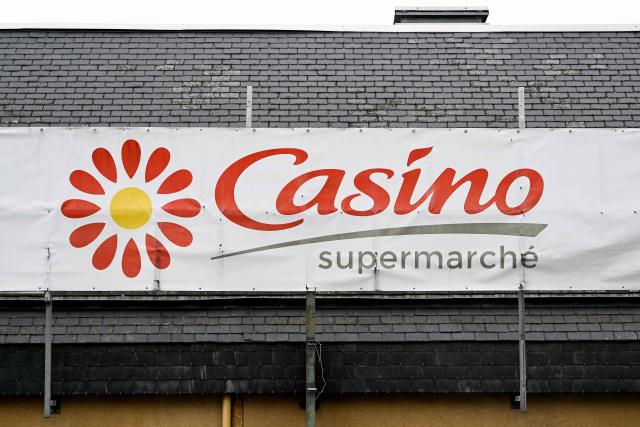 (FILES) This photograph shows the logo of Casino of a Casino shop in Ploubalay, western France on July 5, 2023. On November 24, 2025, the Casino Group announced that it would be bringing together its creditors to begin negotiations on a new debt restructuring, the second in less than three years, with its main shareholder, Daniel Kretinsky, saying he was prepared to contribute Ђ300 million. (Photo by Damien MEYER / AFP)