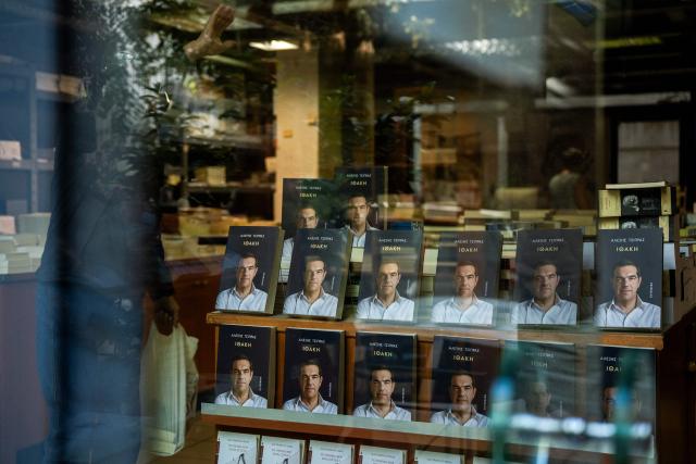 A photograph taken on November 24, 2025 shows the new book by Greek former Prime Minister Alexis Tsipras displayed in a bookshop in Athens, on the day of its release. Greek former Prime Minister Alexis Tsipras published a long-awaited memoir ten years after a traumatic management of the country's debt crisis, as he reportedly mulls a political comeback. (Photo by Angelos TZORTZINIS / AFP)