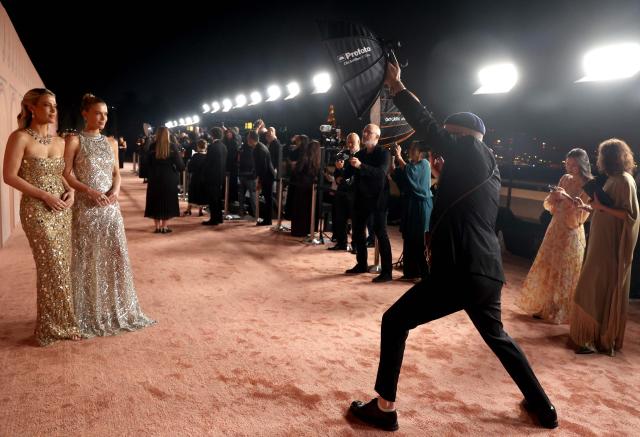 Eliza (L) and Emma Spencer pose on the red carpet of the inaugural Franca Fund Gala held on November 23, 2025 at the Museum of Islamic Art in Doha, Qatar. This milestone event is the latest initiative from the foundation, which honors the life and legacy ofthe late Franca Sozzani, the trailblazing editor-in-chief of Vogue Italia, by raising critical funds to drive research in preventative genomics. (Photo by Patrick BAZ / Qatar Creates / FACTSTORY) / Disclaimer: This document is neither produced nor endorsed by AFP. It is distributed under its issuer sole responsibility. Its reproduction is authorized in context without any distortion of content. If you have any question about this document, please contact its issuer.