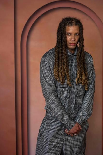 Chuck Junior Achike poses  on the red carpet of the inaugural Franca Fund Gala held on November 23, 2025 at the Museum of Islamic Art in Doha, Qatar. This milestone event is the latest initiative from the foundation, which honors the life and legacy ofthe late Franca Sozzani, the trailblazing editor-in-chief of Vogue Italia, by raising critical funds to drive research in preventative genomics. (Photo by AMMAR ABD RABBO / Qatar Creates / FACTSTORY) / Disclaimer: This document is neither produced nor endorsed by AFP. It is distributed under its issuer sole responsibility. Its reproduction is authorized in context without any distortion of content. If you have any question about this document, please contact its issuer.