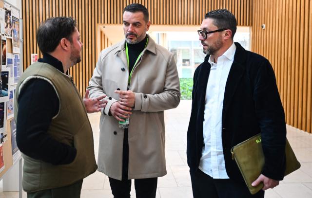 Lawyers Victor Font (L) and Fabien Large (R) speak with ex-husband of Maylis Daubon, Yannick Reverdy outside the courtroom of the Assize Court of the Landes department, in Mont-de-Marsan, in southwestern France, on November 24, 2025, during the trial of Maylis Daubon, charged with poisoning her two daughters, one of whom died. The trial of Maylis Daubon, 53, accused of poisoning her two daughters, one of whom died, by drugging them, then attempting to have their father murdered from prison, is set to open on November 24. Maylis Daubon has maintained since her indictment and imprisonment in January 2022 that her eldest daughter, who died at the age of 18, committed suicide. (Photo by Gaizka IROZ / AFP)