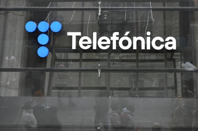(FILES) This photograph shows the logo of Telefonica at the company's headquarters in Madrid on December 4, 2023. Spain telecoms giant Telefonica announced a redundancy plan, seeking up to 5,000 job cuts according to unions, AFP reports on November 24, 2025 (Photo by JAVIER SORIANO / AFP)
