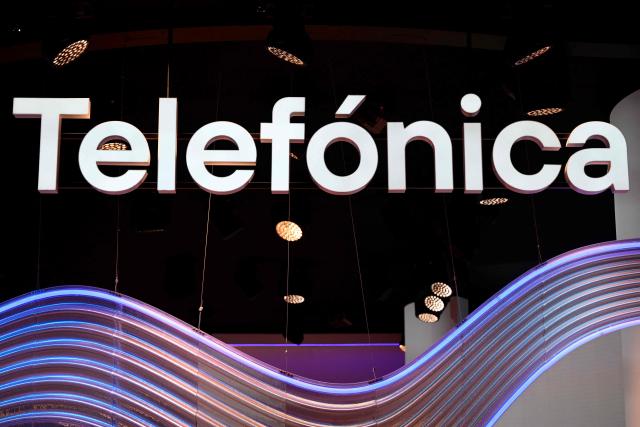 (FILES) This photograph shows Telefonica's logo during the Mobile World Congress (MWC), the telecom industry's biggest annual gathering, in Barcelona on February 28, 2024. Spain telecoms giant Telefonica announced a redundancy plan, seeking up to 5,000 job cuts according to unions, AFP reports on November 24, 2025 (Photo by Josep LAGO / AFP)