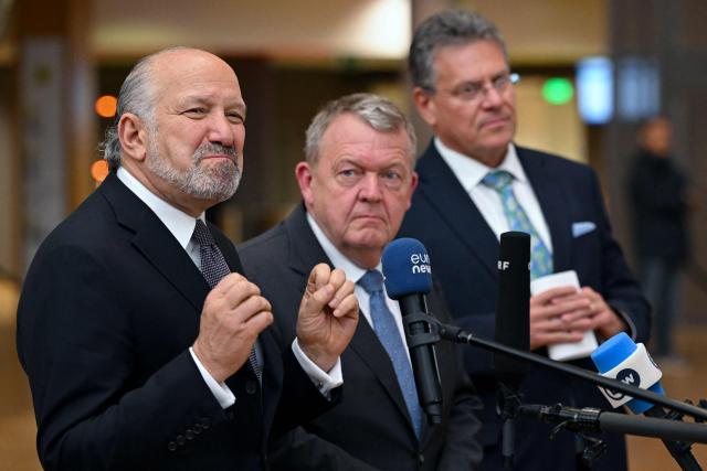 (From L) US' Commerce Secretary Howard Lutnick delivers remarks to the press flanked by Denmark's Foreign Affairs Minister Lars Lokke Rassmussen and EU Commissioner for Trade and Economic Security, Interinstitutional relations and Transparency Maros Sefcovic at the end of an EU Foreign Affairs Council about Trade in Brussels on November 24, 2025. (Photo by Nicolas TUCAT / AFP)