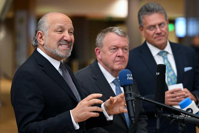 (From L) US' Commerce Secretary Howard Lutnick delivers remarks to the press flanked by Denmark's Foreign Affairs Minister Lars Lokke Rassmussen and EU Commissioner for Trade and Economic Security, Interinstitutional relations and Transparency Maros Sefcovic at the end of an EU Foreign Affairs Council about Trade in Brussels on November 24, 2025. (Photo by Nicolas TUCAT / AFP)