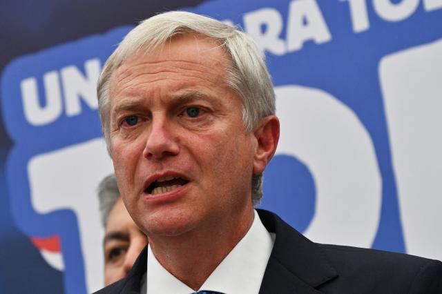 Chile's presidential candidate Jose Antonio Kast of the Republican party, speaks after a meeting with security advisers, in Santiago, on November 24, 2025. Leftist candidate Jeannette Jara and far-right leader Jose Antonio Kast will go head-to-head in Chile's presidential run-off after topping the first round of voting in an election dominated by fears of violent crime. (Photo by RODRIGO ARANGUA / AFP)