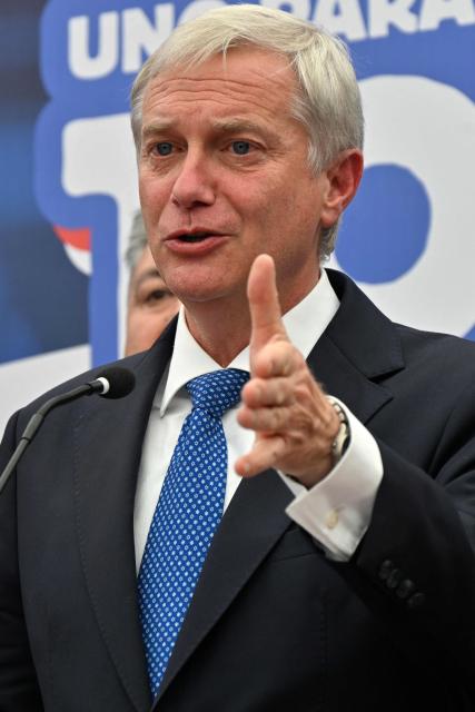 Chile's presidential candidate Jose Antonio Kast of the Republican party, speaks after a meeting with security advisers, in Santiago, on November 24, 2025. Leftist candidate Jeannette Jara and far-right leader Jose Antonio Kast will go head-to-head in Chile's presidential run-off after topping the first round of voting in an election dominated by fears of violent crime. (Photo by RODRIGO ARANGUA / AFP)