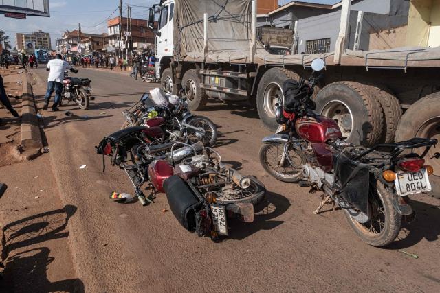 Motorcycle taxis lay on the road left behind by riders as supporters of National Unity Platform (NPU) presidential candidate and opposition leader Robert Kyagulanyi, also known as Bobi Wine, flee from tear gas fired by Ugandan police officers during a dispersal operation following his presidential campaign rally in Kampala, on November 24, 2025. Bobi Wine, the main challenger to President Yoweri Museveni's 40-year rule in Uganda, drew vast crowds as he brought his campaign to the capital Kampala on November 24, 2025 ahead of January's election.
Wine, whose real name is Robert Kyagulanyi, is a 43-year-old singer turned politician who has become hugely popular among Ugandan young people but faces a deeply entrenched political machine led by the 81-year-old Museveni. (Photo by Badru Katumba / AFP)