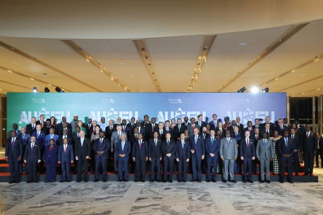 European and African leaders line up for the family photo at the end of the first day of the Africa Union (AU) - European Union (EU) Summit the Salao Protocolar in Luanda on November 24, 2025. (Photo by Ludovic MARIN / AFP)