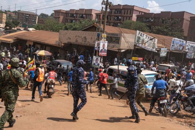 Ugandan military police disperse supporters of the National Unity Platform (NUP) presidential candidate and opposition leader Robert Kyagulanyi, also known as Bobi Wine, during a presidential campaign rally in Kampala on November 24, 2025. Bobi Wine, the main challenger to President Yoweri Museveni's 40-year rule in Uganda, drew vast crowds as he brought his campaign to the capital Kampala on November 24, 2025 ahead of January's election.
Wine, whose real name is Robert Kyagulanyi, is a 43-year-old singer turned politician who has become hugely popular among Ugandan young people but faces a deeply entrenched political machine led by the 81-year-old Museveni. (Photo by BADRU KATUMBA / AFP)
