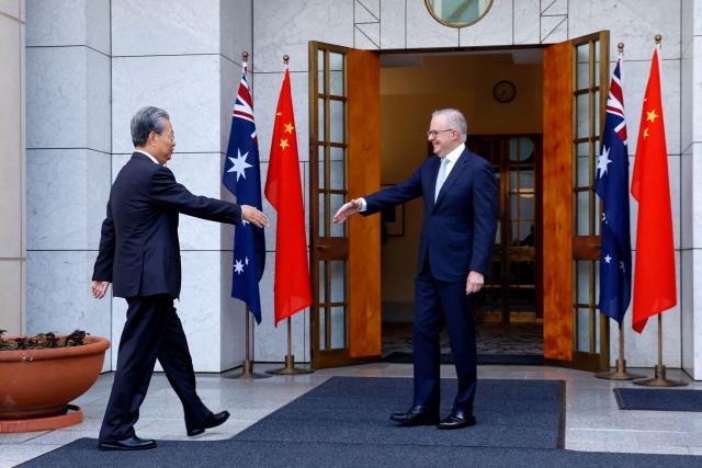 Australia’s Prime Minister Anthony Albanese (R), shakes hands with Zhao Leji, Chairman of the Standing Committee of China’s National People’s Congress (NPC), at Parliament House in Canberra on November 25, 2025. Zhao is on an official four-day visit to Australia. (Photo by HILARY WARDAUGH / AFP)