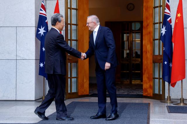 Australia’s Prime Minister Anthony Albanese (R), shakes hands with Zhao Leji, Chairman of the Standing Committee of China’s National People’s Congress (NPC), at Parliament House in Canberra on November 25, 2025. Zhao is on an official four-day visit to Australia. (Photo by HILARY WARDAUGH / AFP)
