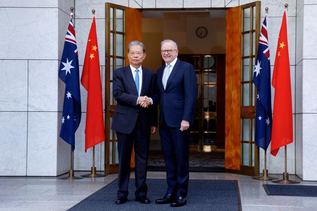 Australia’s Prime Minister Anthony Albanese (R), shakes hands with Zhao Leji, Chairman of the Standing Committee of China’s National People’s Congress (NPC), at Parliament House in Canberra on November 25, 2025. Zhao is on an official four-day visit to Australia. (Photo by HILARY WARDAUGH / AFP)