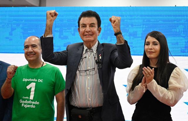 Honduran Presidential candidate for the opposition Liberal party Salvador Narsalla arrives for a press conference with his wife Iroshka Elvir at his party headquarters in Tegucigalpa on November 24, 2025. Honduras will hold presidential elections on November 30, 2025. (Photo by Orlando SIERRA / AFP)