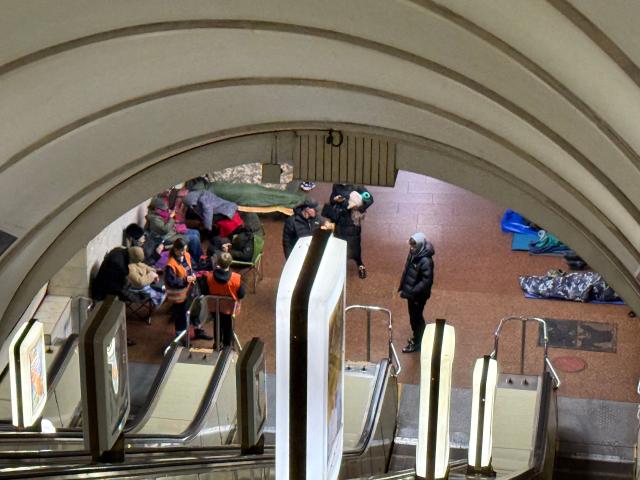 People take shelter at a metro station during Russian air attacks in Kyiv on November 25, 2025, amid the Russian invasion of Ukraine. Powerful explosions rocked Ukraine's capital Kyiv, an AFP journalist heard, as the air force issued a countrywide missile warning early November 25, 2025. (Photo by Yan Dobronosov / AFP)
