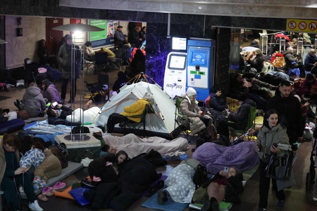 People take shelter at a metro station during Russian air attacks in Kyiv on November 25, 2025, amid the Russian invasion of Ukraine. Powerful explosions rocked Ukraine's capital Kyiv, an AFP journalist heard, as the air force issued a countrywide missile warning early November 25, 2025. (Photo by Yan Dobronosov / AFP)