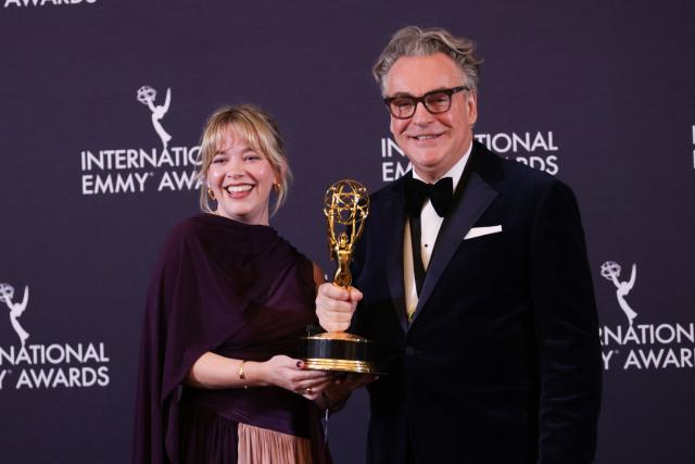 British producer Anya Wilson and British executive producer Kenton Allen pose in the press room with the Comedy award for "Ludwig" during the 53rd International Emmy Awards Gala at the New York Hilton Midtown on November 24, 2025 in New York City. (Photo by Leonardo MUNOZ / AFP)