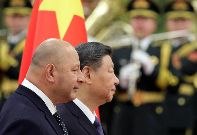 Tonga's King Tupou VI and China’s President Xi Jinping attend a welcoming ceremony at the Great Hall of the People in Beijing on November 25, 2025. (Photo by Maxim Shemetov / POOL / AFP)