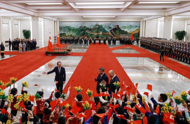 Tonga's King Tupou VI and China’s President Xi Jinping attend a welcoming ceremony at the Great Hall of the People in Beijing on November 25, 2025. (Photo by Maxim Shemetov / POOL / AFP)