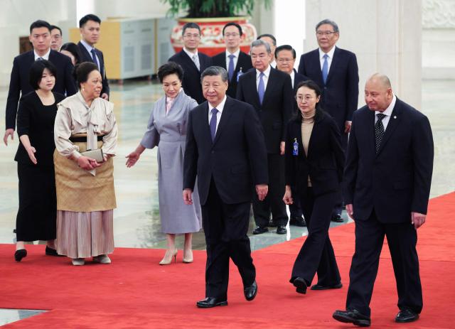 China’s President Xi Jinping, his wife Peng Liyuan (3rd-L), Tonga's King Tupou VI (R) and Queen Nanasipau'u Tuku?aho (2nd-L) attend a welcoming ceremony at the Great Hall of the People in Beijing on November 25, 2025. (Photo by Maxim Shemetov / POOL / AFP)