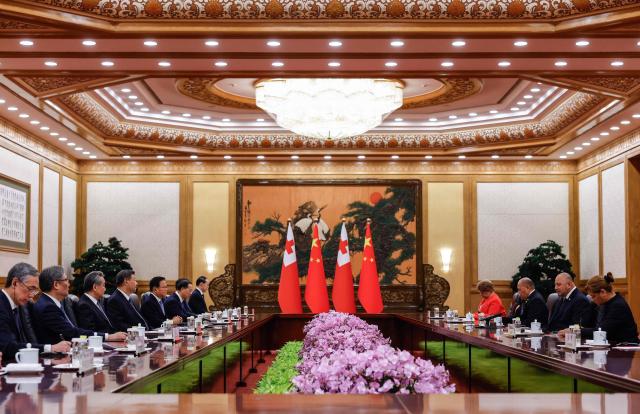 Tonga's King Tupou VI (center-R) and China’s President Xi Jinping (center-L) attend a meeting at the Great Hall of the People in Beijing on November 25, 2025. (Photo by Maxim Shemetov / POOL / AFP)