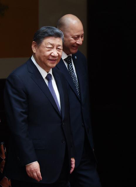 Tonga's King Tupou VI and China’s President Xi Jinping arrive to a signing ceremony at the Great Hall of the People in Beijing on November 25, 2025. (Photo by Maxim Shemetov / POOL / AFP)
