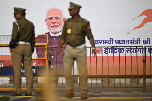 Police personnel stand guard near Ram Temple in Ayodhya on November 25, 2025, ahead of Indian Prime Minister Narendra Modi’s visit. (Photo by Sajjad  HUSSAIN / AFP)