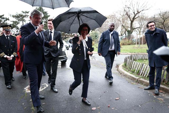 France's Education Minister Edouard Geffray (2nd L) and France's Culture Minister Rachida Dati (C) react as they arrive to meet with students of a cinema-audiovisual speciality class at the Leon Blum Secondary School, in Creteil, Paris suburb on November 25, 2025. (Photo by Thibaud MORITZ / AFP)
