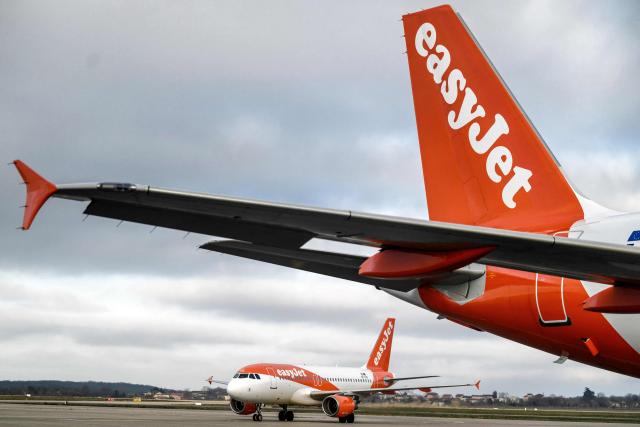 (FILES) This photograph taken on February 5, 2024 shows EasyJet planes on the tarmac of the Saint Exupery Airport in Colombier Saugnieu, southeastern France. British no-frills airline EasyJet on November 25, 2025 said its annual net profit rose on the back of strong sales of its package holidays. The carrier that flies mainly in Europe said profit after tax climbed nine percent to 648 million USD in the 12 months to the end of September, compared with its previous financial year. (Photo by JEFF PACHOUD / AFP)