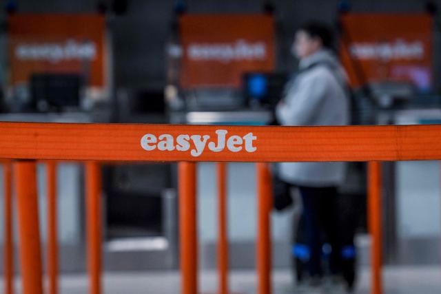 (FILES) The logo of British low-cost airline easyJet is pictured at Humberto Delgado airport in Lisbon on April 1, 2023. British no-frills airline EasyJet on November 25, 2025 said its annual net profit rose on the back of strong sales of its package holidays. The carrier that flies mainly in Europe said profit after tax climbed nine percent to 648 million USD in the 12 months to the end of September, compared with its previous financial year. (Photo by PATRICIA DE MELO MOREIRA / AFP)