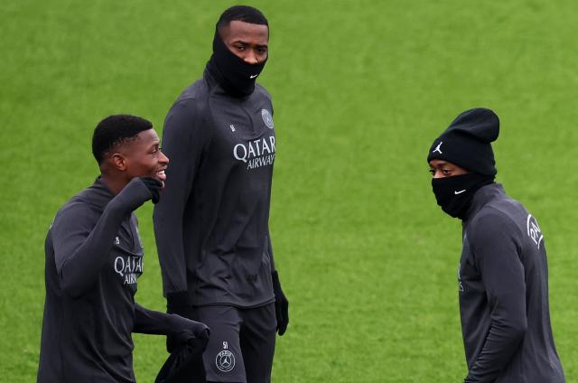 (from L) Paris Saint-Germain's Portuguese defender #25 Nuno Mendes, Paris Saint-Germain's French defender #51 William Pacho and Paris Saint-Germain's French forward #10 Ousmane Dembele attend during a training session at the Campus Paris Saint-Germain in Poissy, in the western outskirts of Paris, on November 25, 2025, on the eve of the UEFA Champions League first round day 5 football match between Paris Saint-Germain and Tottenham Hotspur. (Photo by FRANCK FIFE / AFP)