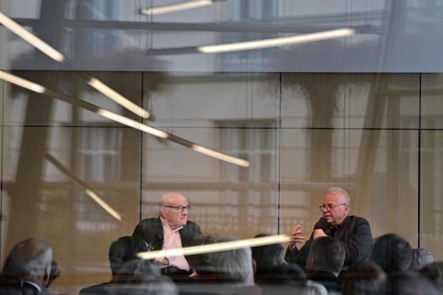 French-German politician and former European member of Parliament Daniel Cohn-Bendit talks to German film director Volker Schloendorff after being awarded with the 2025 Berlin Academy Prize in Berlin on November 25, 2025. (Photo by John MACDOUGALL / AFP)