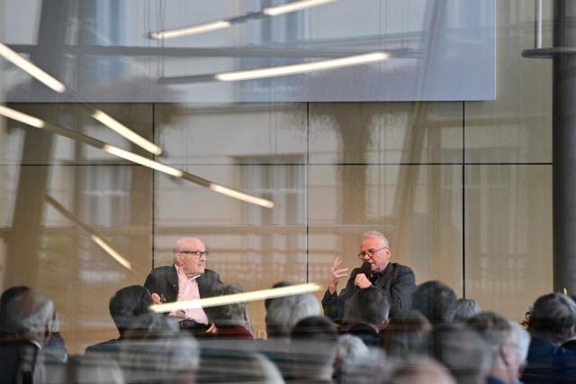 French-German politician and former European member of Parliament Daniel Cohn-Bendit talks to German film director Volker Schloendorff after being awarded with the 2025 Berlin Academy Prize in Berlin on November 25, 2025. (Photo by John MACDOUGALL / AFP)