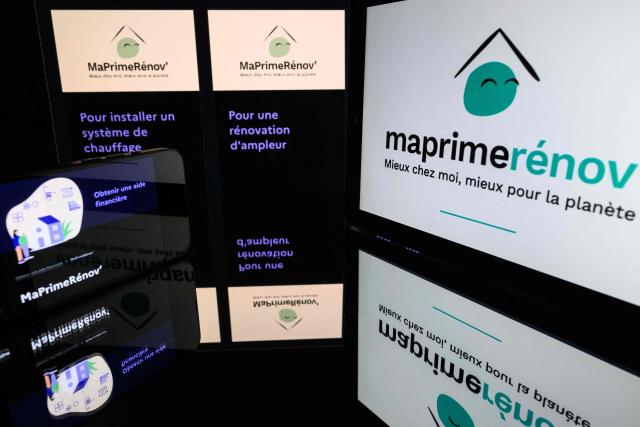 This illustration photograph shows screens displaying the government's aid "MaPrimeRenov'" (Ma Prime Renov') logo and website, on November 25, 2025 in Toulouse, southwestern france. (Photo by Lionel BONAVENTURE / AFP)