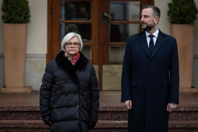French Minister of the Armed Forces Catherine Vautrin (L) and Poland's Minister of Defence Wladyslaw Kosiniak-Kamysz review an honor guard during an official welcoming ceremony in front of the ministry building in Warsaw, Poland, on November 25, 2025. (Photo by Wojtek RADWANSKI / AFP)