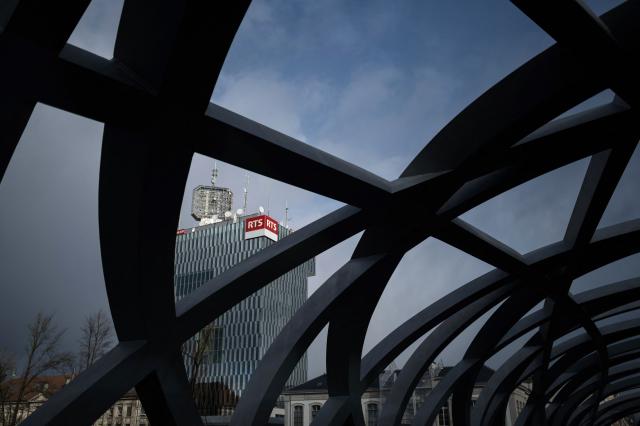 This photograph shows the tower of Swiss French speaking Radio and Television (RTS), part of the Swiss Broadcasting Corporation (SRG SSR), in Geneva on November 25, 2025. The public broadcasting group, which operates channels in the country's four official languages announced on November 24, 2025 a cost-cutting program that will result in the elimination of 900 positions by 2029, due to upheaval in the media market and the gradual reduction of the license fee. (Photo by Fabrice COFFRINI / AFP)