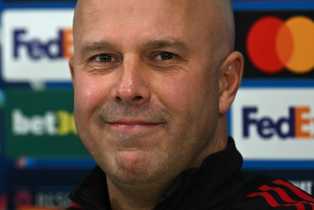 Liverpool's Dutch manager Arne Slot smiles during a press conference at Anfield in Liverpool, north-west England, on November 25, 2025, on the eve of their UEFA Champions League league phase football match against PSV Eindhoven.  (Photo by Paul ELLIS / AFP)
