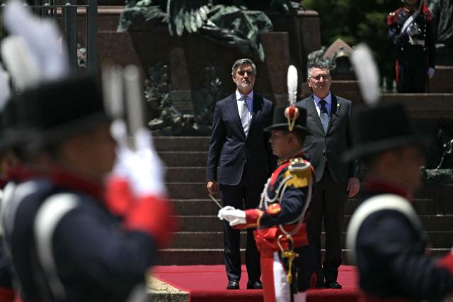 Israel's Foreign Minister Gideon Sa'ar (R) and Argentina's Secretary of International Economic Relations Fernando Brun take part in a wreath-laying ceremony in homage to Argentine national hero General Jose de San Martin in Buenos Aires on November 25, 2025. Sa'ar is in Argentina on official visit. (Photo by JUAN MABROMATA / AFP)