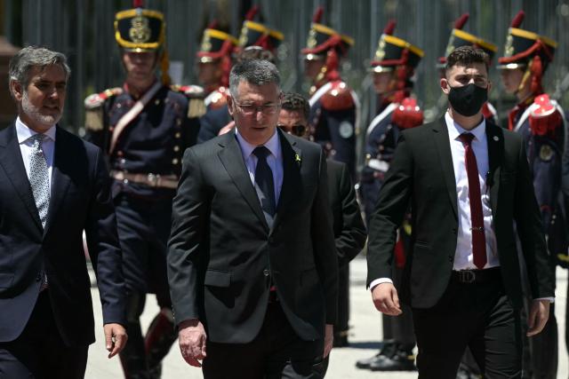Israel's Foreign Minister Gideon Sa'ar (C) and Argentina's Secretary of International Economic Relations Fernando Brun (L) take part in a wreath-laying ceremony in homage to Argentine national hero General Jose de San Martin in Buenos Aires on November 25, 2025. Sa'ar is in Argentina on official visit. (Photo by JUAN MABROMATA / AFP)