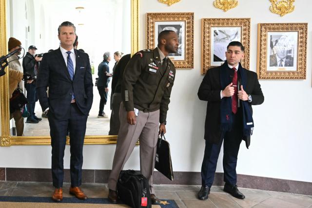 US Secretary of Defense Pete Hegseth (L) looks on before the start of the White House turkey pardon ceremony in the Rose Garden of the White House in Washington, DC on November 25, 2025. (Photo by ANDREW CABALLERO-REYNOLDS / AFP)