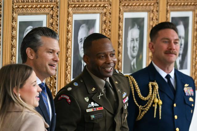 US Secretary of Defense Pete Hegseth (2L) looks on colonnade the before the start of the White House turkey pardon ceremony in the Rose Garden of the White House in Washington, DC on November 25, 2025. (Photo by ANDREW CABALLERO-REYNOLDS / AFP)
