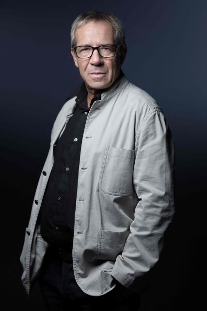 French investigative journalist Frederic Ploquin poses during a photo session in Paris on November 24, 2025. (Photo by JOEL SAGET / AFP)