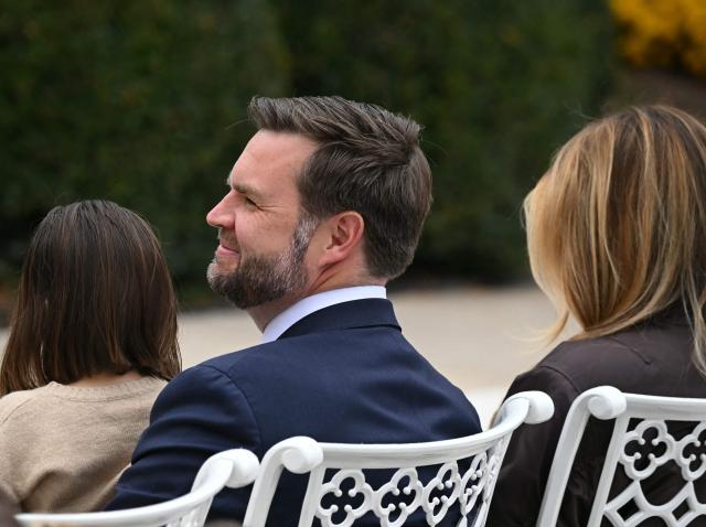 US Vice President JD Vance listens as President Donald Trump speaks during the turkey pardon ceremony in the Rose Garden of the White House in Washington, DC on November 25, 2025. (Photo by ANDREW CABALLERO-REYNOLDS / AFP)