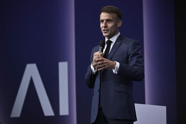 France's President Emmanuel Macron gestures as he speaks during the opening of the "Adopt AI" international summit on artificial intelligence, at the Grand Palais in Paris on November 25, 2025. (Photo by JULIEN DE ROSA / POOL / AFP)