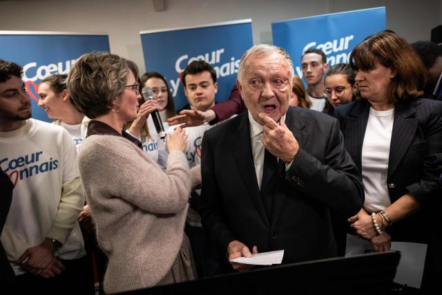 President of Business software publisher Cegid and Vice-President of French Football Federation (FFF) Jean-Michel Aulas (CR) reacts during the inauguration of his campaign headquarters for Mayor of Lyon in France's 2026 municipal elections, in Lyon, central-eastern France, on November 25, 2025. (Photo by ARNAUD FINISTRE / AFP)
