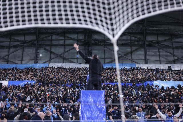Marseille supporters cheer their team prior to the UEFA Champions League, league phase - matchday 5, football match between Olympique de Marseille (OM) and Newcastle United FC at the Velodrome Stadium in Marseille, southeastern France, on November 25, 2025. (Photo by Alex MARTIN / AFP)