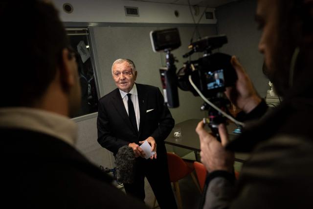 President of Business software publisher Cegid and Vice-President of French Football Federation (FFF) Jean-Michel Aulas (C) speaks to journalists during the inauguration of his campaign headquarters for Mayor of Lyon in France's 2026 municipal elections, in Lyon, central-eastern France, on November 25, 2025. (Photo by ARNAUD FINISTRE / AFP)
