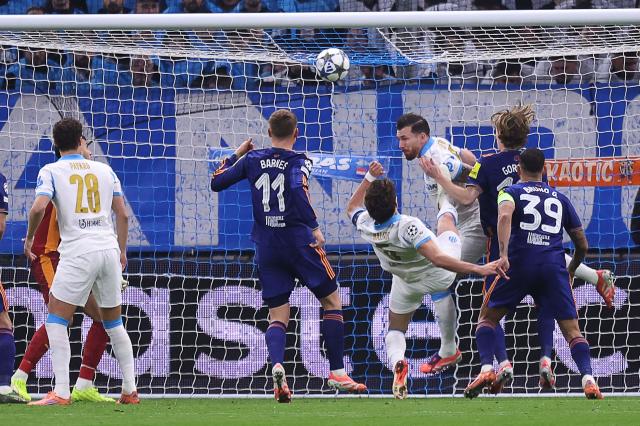 Marseille's Danish midfielder #23 Pierre-Emile Hojbjerg (3rd R) saves the ball during the UEFA Champions League, league phase - matchday 5, football match between Olympique de Marseille (OM) and Newcastle United FC at the Velodrome Stadium in Marseille, southeastern France, on November 25, 2025. (Photo by Alex MARTIN / AFP)